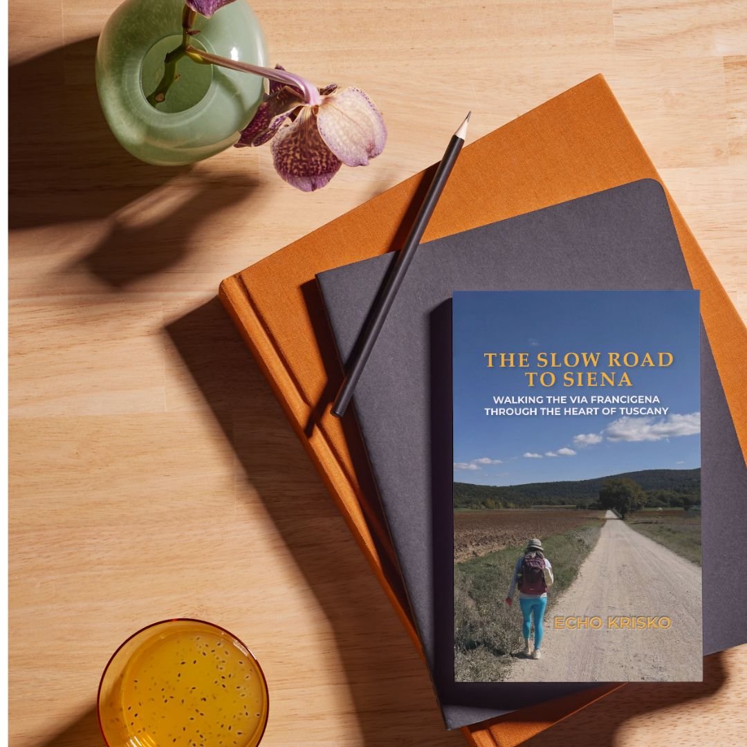 Book_The Slow Road to Siena | WISE360 a book and notebooks on top of a table